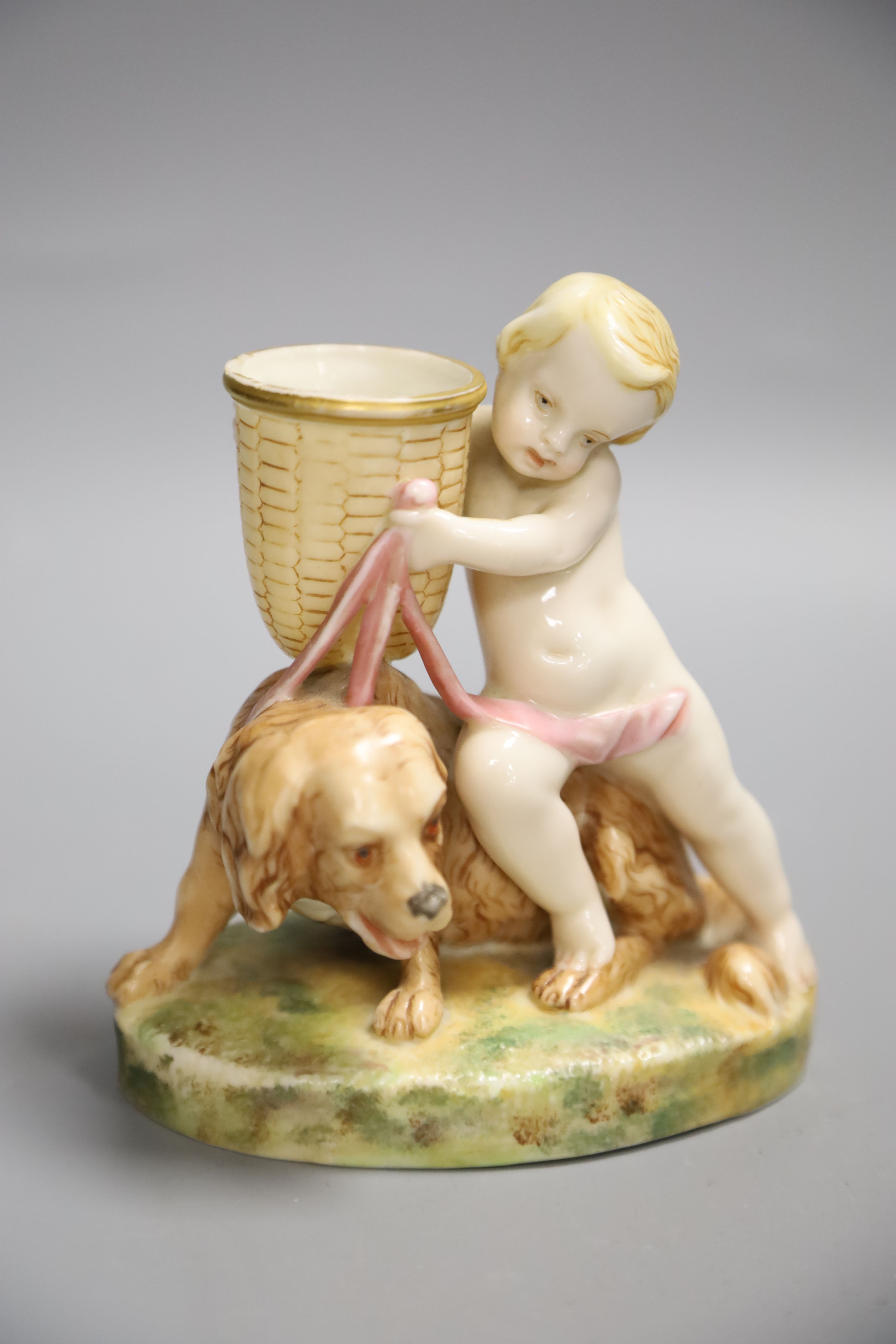 A Royal Worcester figure group of a child and dog, height 13cm
